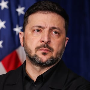 Ukrainian President Volodymyr Zelensky listens during a press conference with U.S. President Donald Trump following their meeting at Trump’s Mar-a-Lago club on December 28, 2025 in Palm Beach, Florida.