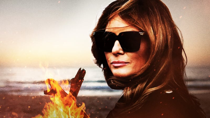 Melania enjoying a warm bonfire.