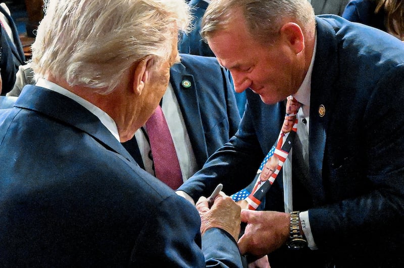The president signed Nehls' Trump-themed tie after his State of the Union address in February.