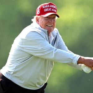 Former President Donald Trump follows his second shot during the pro-am prior to the LIV Golf Invitational - DC at Trump National Golf Club on May 25, 2023 in Sterling, Virginia.