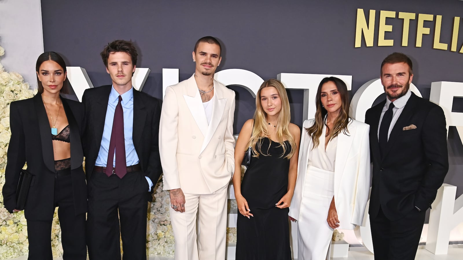 LONDON, ENGLAND - OCTOBER 08: (L to R) Jackie Apostel, Cruz Beckham, Romeo Beckham, Harper Beckham, Victoria Beckham and David Beckham attend the World Premiere of "Victoria Beckham" at The Curzon Mayfair on October 8, 2025 in London, England.