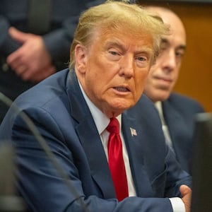 Donald Trump attends a pre-trial hearing at Manhattan Criminal Court.