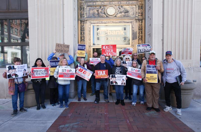 Protestors gather outside the offices of Sen. Joni Ernst (R-IA) and Rep. Mariannette Miller-Meeks (R-IA) on November 5, 2025, in Davenport, Iowa.