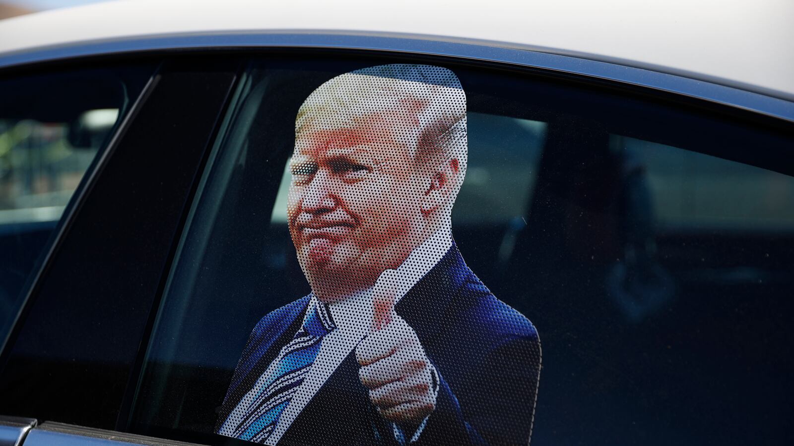 CARSON CITY, NV - OCTOBER 18: A photograph of President Donald Trump is seen on a car window before a campaign rally on October 18, 2020 in Carson City, Nevada. With 16 days to go before the November election, President Trump is back on the campaign trail with multiple daily events as he continues to campaign against Democratic presidential nominee Joe Biden. (Photo by Stephen Lam/Getty Images)