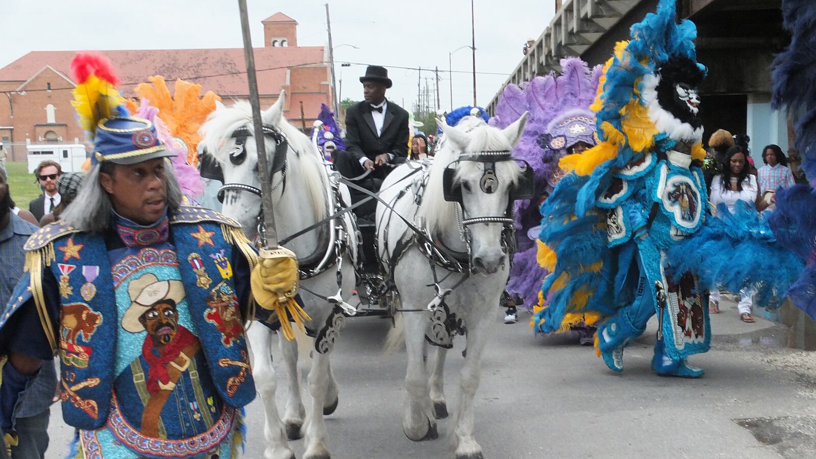 articles/2014/05/16/mardi-gras-indian-chief-larry-bannock-s-final-ride/140515-berry-nola-indian-funeral-tease_czzqml
