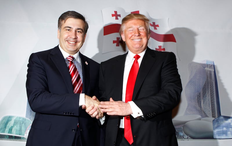 President of Georgia, Mikheil Saakashvili, shakes hands with Donald Trump after an announcement that Trump is investing in the development of luxury properties in the country at a news conference in New York March 10, 2011.