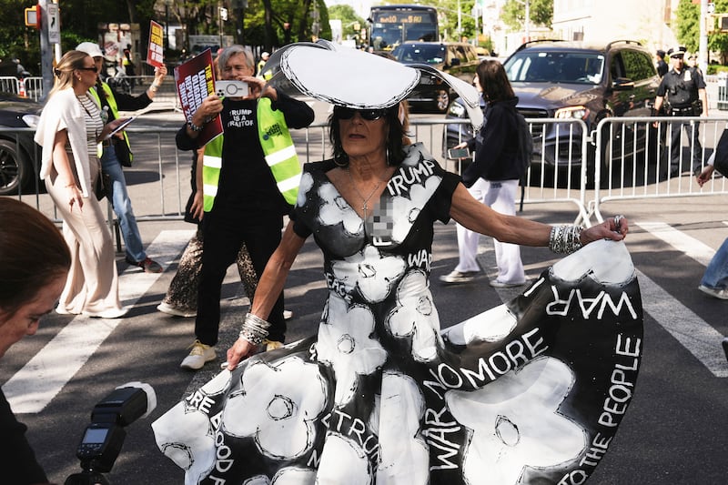 A costumed demonstrator participates in a “Resistance Red Carpet” protest against the Met Gala, the star-studded fundraiser known for its extravagant fashion and high-profile guests, in New York City, on May 4, 2026.
