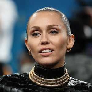 Miley Cyrus poses during the Met Gala, an annual fundraising gala held for the benefit of the Metropolitan Museum of Art's Costume Institute with this year's theme 'Superfine: Tailoring Black Style,' in New York City, New York, U.S., May 5, 2025. REUTERS/Mario Anzuoni
