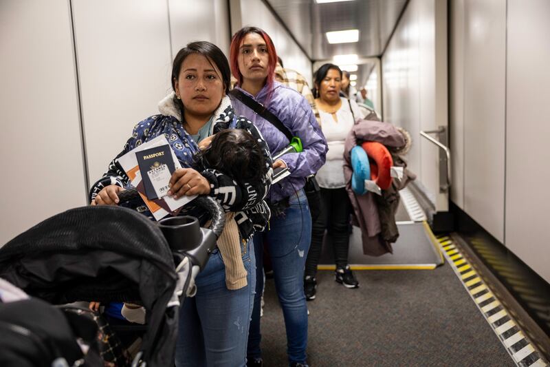 Ecuadorian mothers Andrea, 28, (L) and her cousin Jennyfer nervously prepare to board their flight to Ecuador from JFK International Airport on October 27, 2025 in New York, New York. They had decided to "self deport" after their husbands were detained by U.S. Immigration and Customs Enforcement (ICE).
