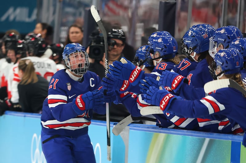 Hilary Knight #21 of Team United States celebrates with teammates after scoring a goal in the third period during the Women's Gold Medal match between the United States and Canada on day 13 of the Milano Cortina 2026 Winter Olympic games at Milano Santagiulia Ice Hockey Arena on February 19, 2026 in Milan, Italy.