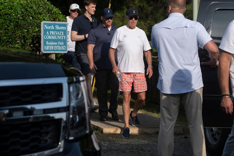 Secret Service agents provide security as US President Joe Biden walks to his vehicle after spending some time at the beach in Cape Henlopen State Park, in Lewes, Delaware, on August 28, 2024.