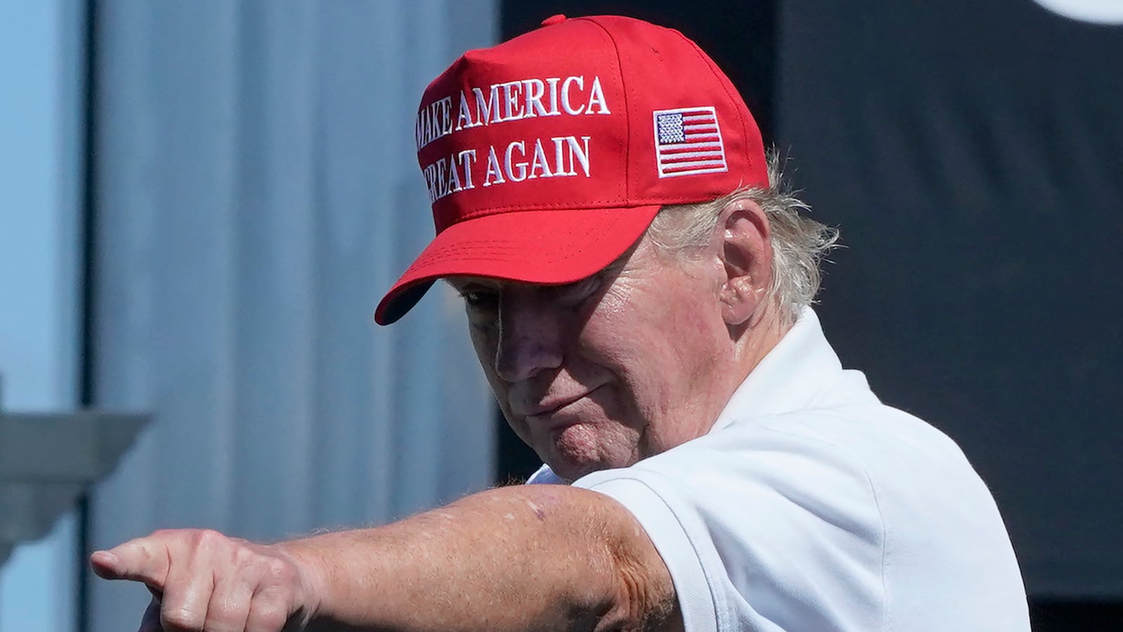 Former US President Donald Trump points at the crowd as he attends Round 3 of the LIV Golf-Bedminster