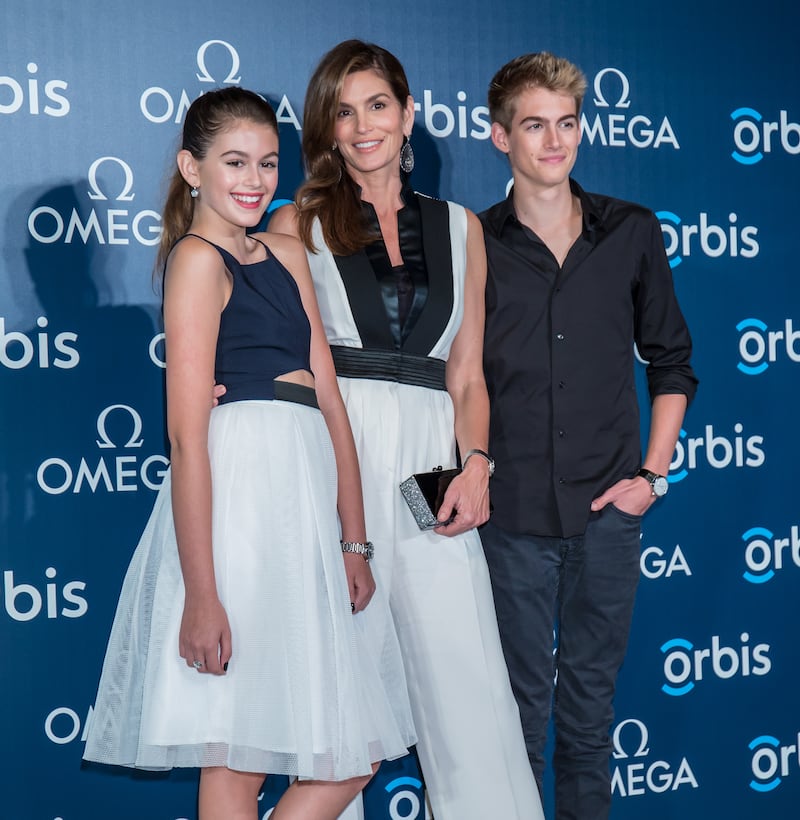 Supermodel Cindy Crawford poses with her daughter Kaia Gerber, and son Presley Gerber in 2015.