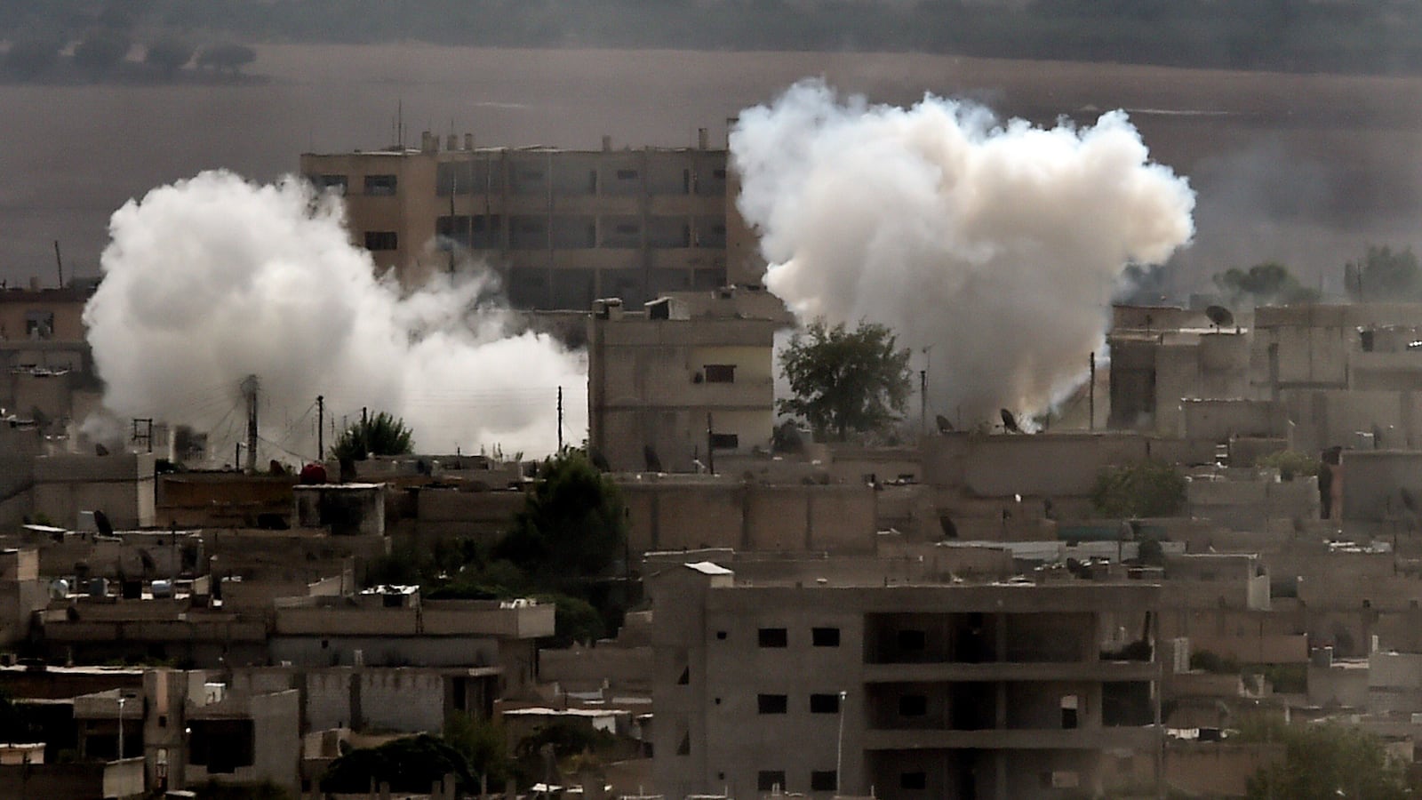 galleries/2014/10/08/unrest-in-kobani/141013-kobani-attack6_amd9kb