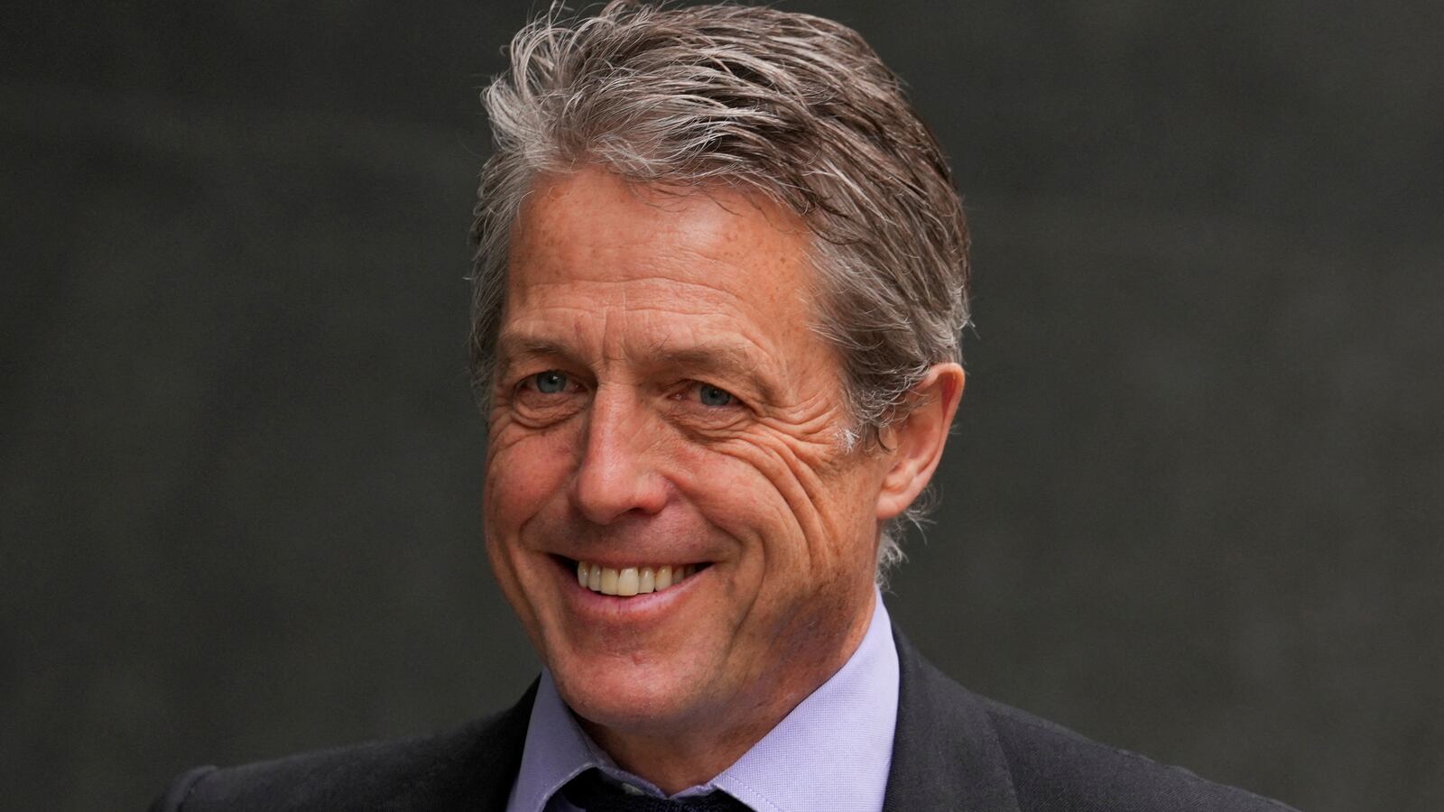 Hugh Grant walks outside the High Court, in London, Britain, April 27, 2023.