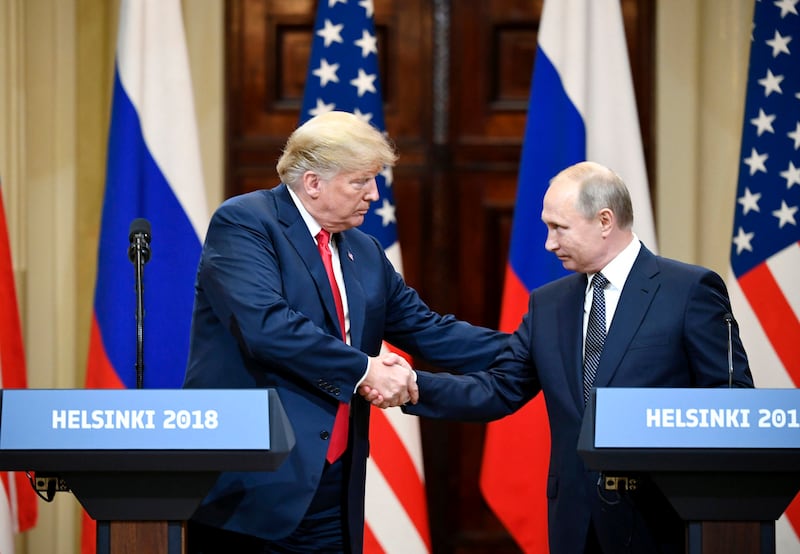 Donald Trump shakes hands with Vladimir Putin during a joint press conference in Helsinki, Finland, on July 16, 2018.