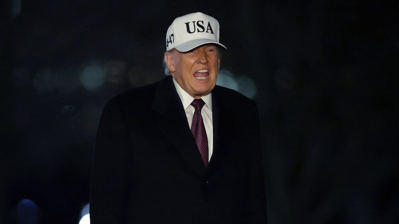 President Donald Trump walks on the South Lawn after he landed at the White House on January 11, 2026 in Washington, DC.