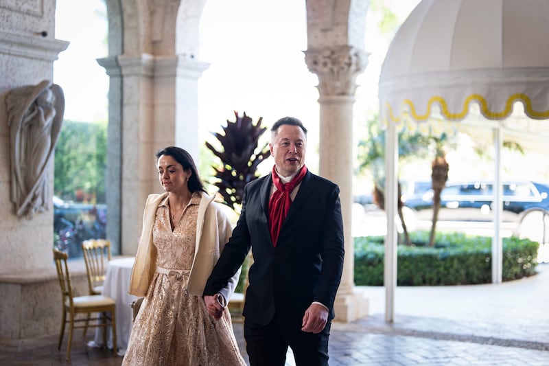 Elon Musk, CEO of Tesla and SpaceX, and Shivon Zilis, a venture capitalist, arrive at Mar-a-Lago on February 1, 2026 in Palm Beach, Florida.