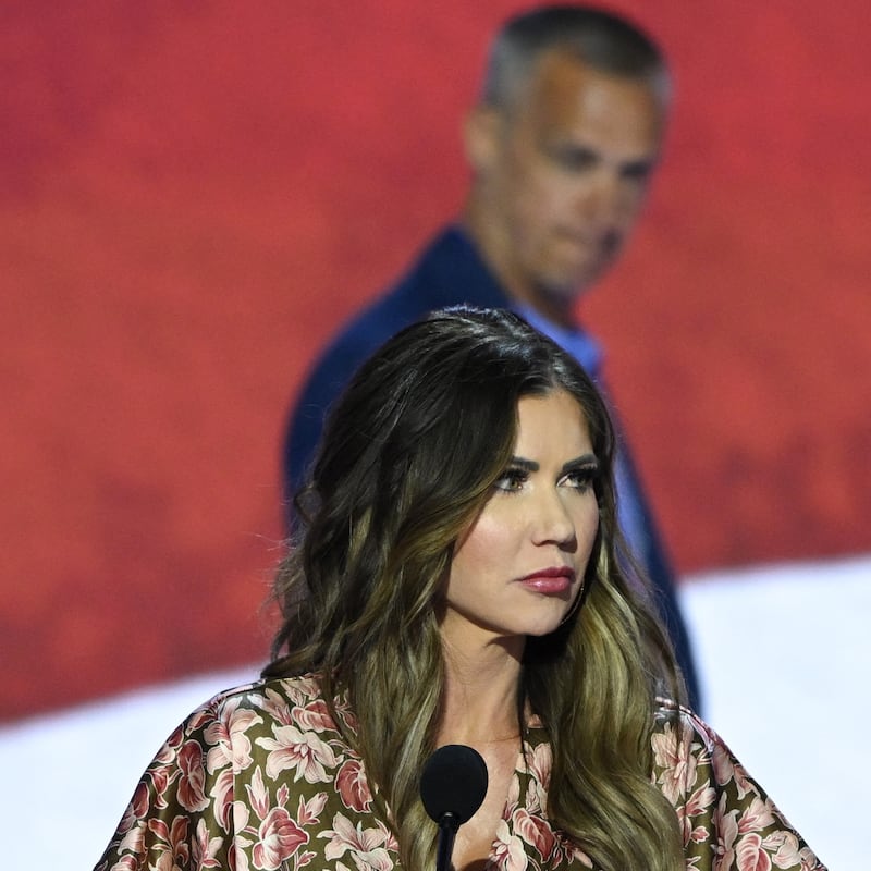 Kristi Noem takes part in a sound check as political commentator Corey Lewandowski looks on at the Fiserv Forum ahead of the 2024 Republican National Convention on July 14, 2024 in Milwaukee, Wisconsin.