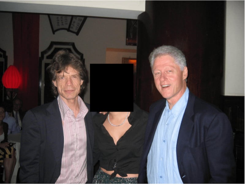 A photo of Mick Jagger, Bill Clinton and an unidentified woman in the Epstein files.