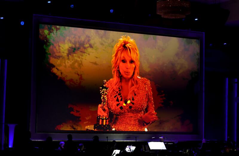 Dolly Parton accepts an Academy Honorary Award via video during the 16th Governors Awards at The Ray Dolby Ballroom on November 16, 2025 in Hollywood, California.
