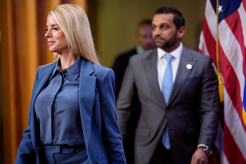 Attorney General Pam Bondi and FBI Director Kash Patel arrive for a news conference at the Department of Justice on December 4, 2025 in Washington, D.C.
