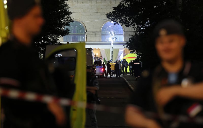 Law enforcement officers and emergency services personnel work at the site of an explosion at a restaurant in central Moscow, Russia August 2, 2026.