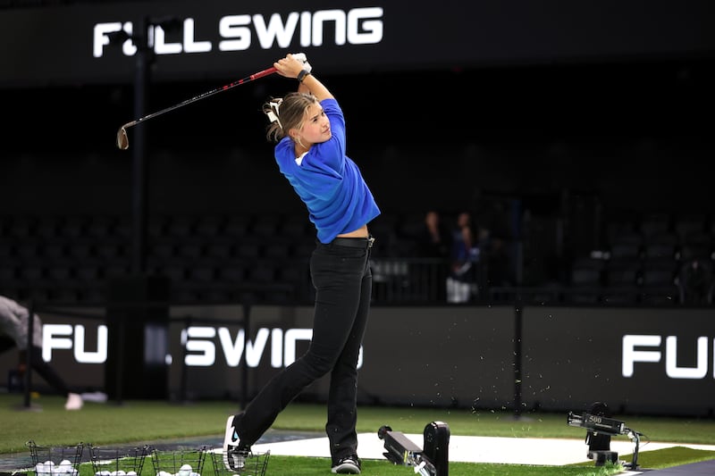 PALM BEACH GARDENS, FLORIDA - JANUARY 27: Kai Trump plays a shot before the TGL presented by SoFi match between the Jupiter Links Golf Club and Boston Common Golf at SoFi Center on January 27, 2025 in Palm Beach Gardens, Florida. (Photo by Megan Briggs/TGL/TGL via Getty Images)
