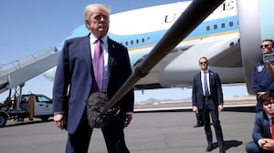 PHOENIX, ARIZONA - APRIL 17: U.S. President Donald Trump speaks to members of the media as he arrives at Sky Harbor International Airport April 17, 2026 in Phoenix, Arizona. Trump is scheduled to speak at a Turning Point USA event titled “Build the Red Wall”, intended to turn out young voters for the midterm elections. (Photo by Win McNamee/Getty Images)