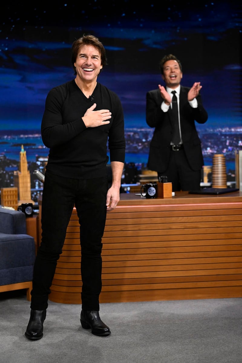 Jimmy Fallon claps and Tom Cruise smiles during a taping of the Tonight Show