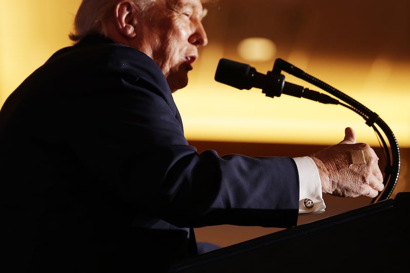 A bandage is seen on President Donald Trump's right hand as he delivers remarks during an event at Mount Airy Casino Resort on December 9, 2025 in Mount Pocono, Pennsylvania.