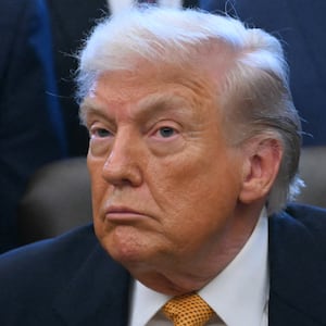 President Donald Trump looks on before signing a bill in the Oval Office of the White House in Washington, DC, on January 14, 2026.