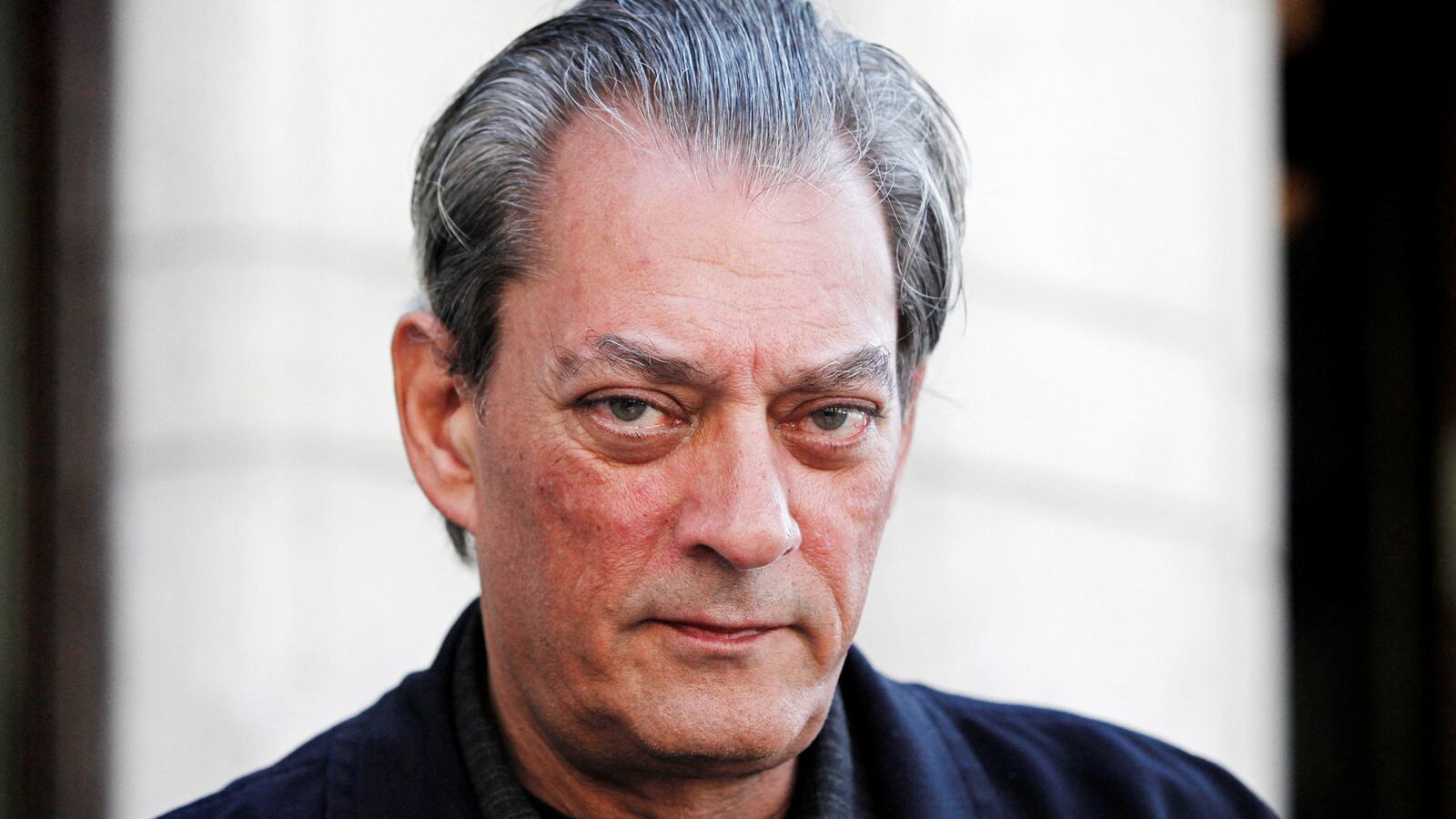 U.S. author Paul Auster poses for a photograph before an interview in Stockholm May 10, 2011.