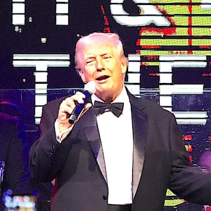 U.S. President Donald Trump speaks to guests during a New Year’s Eve event