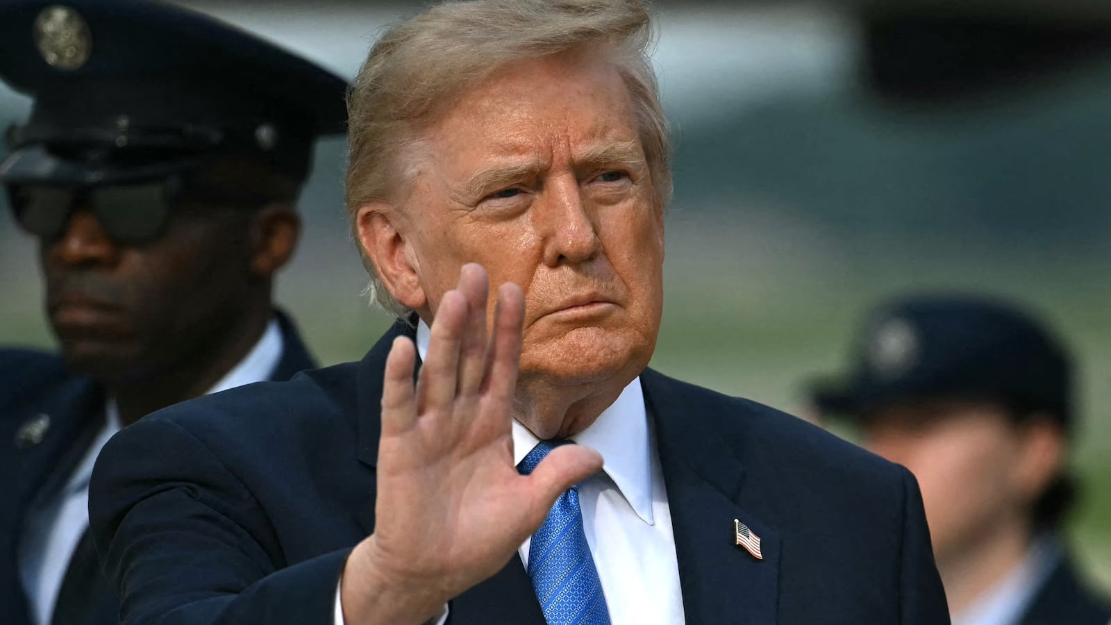 President Donald Trump waves after stepping off Air Force One at Joint Base Andrews, Maryland on August 28, 2026. US President Donald Trump traveled to Houston, Texas, to headline a Republican National Committee (RNC) fundraiser supporting Ken Paxton's US Senate campaign and to present the Artemis II crew with the Congressional Space Medal of Honor for their historic mission around the Moon.