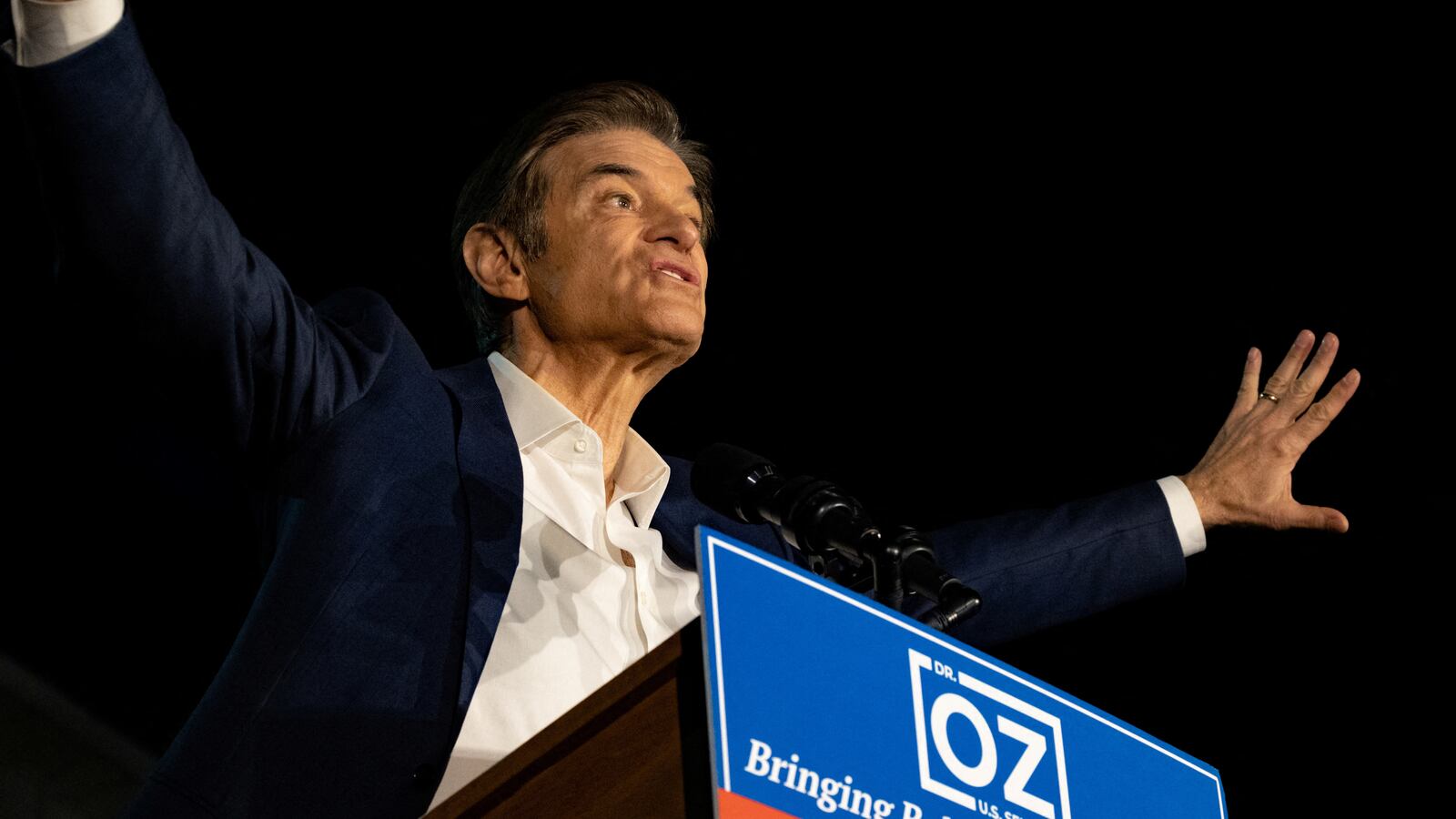 Mehmet Oz speaks at a political rally.