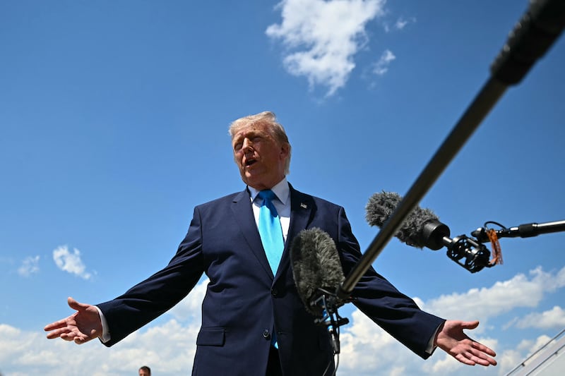 President Donald Trump speaks to reporters after arriving on Air Force One on May 20, 2026 back at Joint Base Andrews, Maryland.