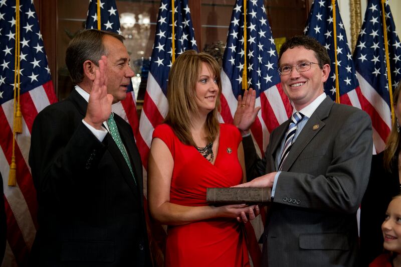 UNITED STATES - NOVEMBER 13: Speaker John Boehner, R-Ohio, left, conducts a ceremonial swearing-in ceremony with Rep.-elect Thomas Massie, R-Ky., as his wife Rhonda, looks on, in the Capitol. The Rep.-elects were sworn in on the House floor after the ceremony. (Photo By Tom Williams/CQ Roll Call)