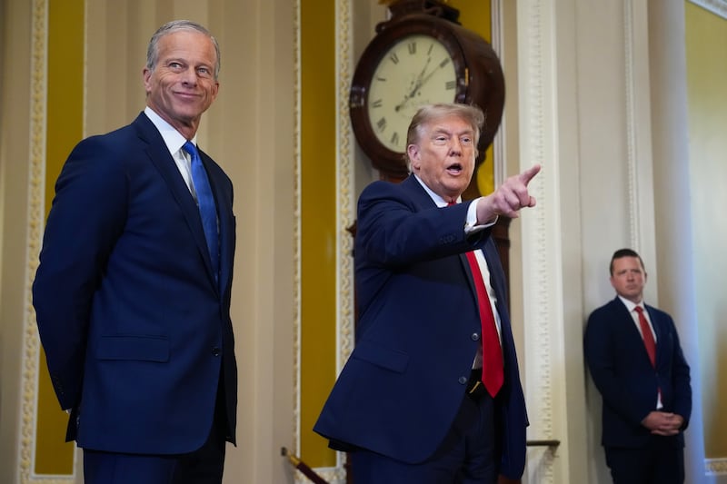 President Donald Trump standing with Senate Majority Leader John Thune on Capitol Hill on June 24, where he met with Senate Republicans after abruptly canceling a signing ceremony for a housing bill, blindsiding members of his own party.