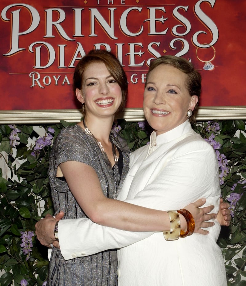 Anne Hathaway (L) and Julie Andrews pose during the premiere of “The Princess Diaries 2: Royal Engagement,”  in 2004.
