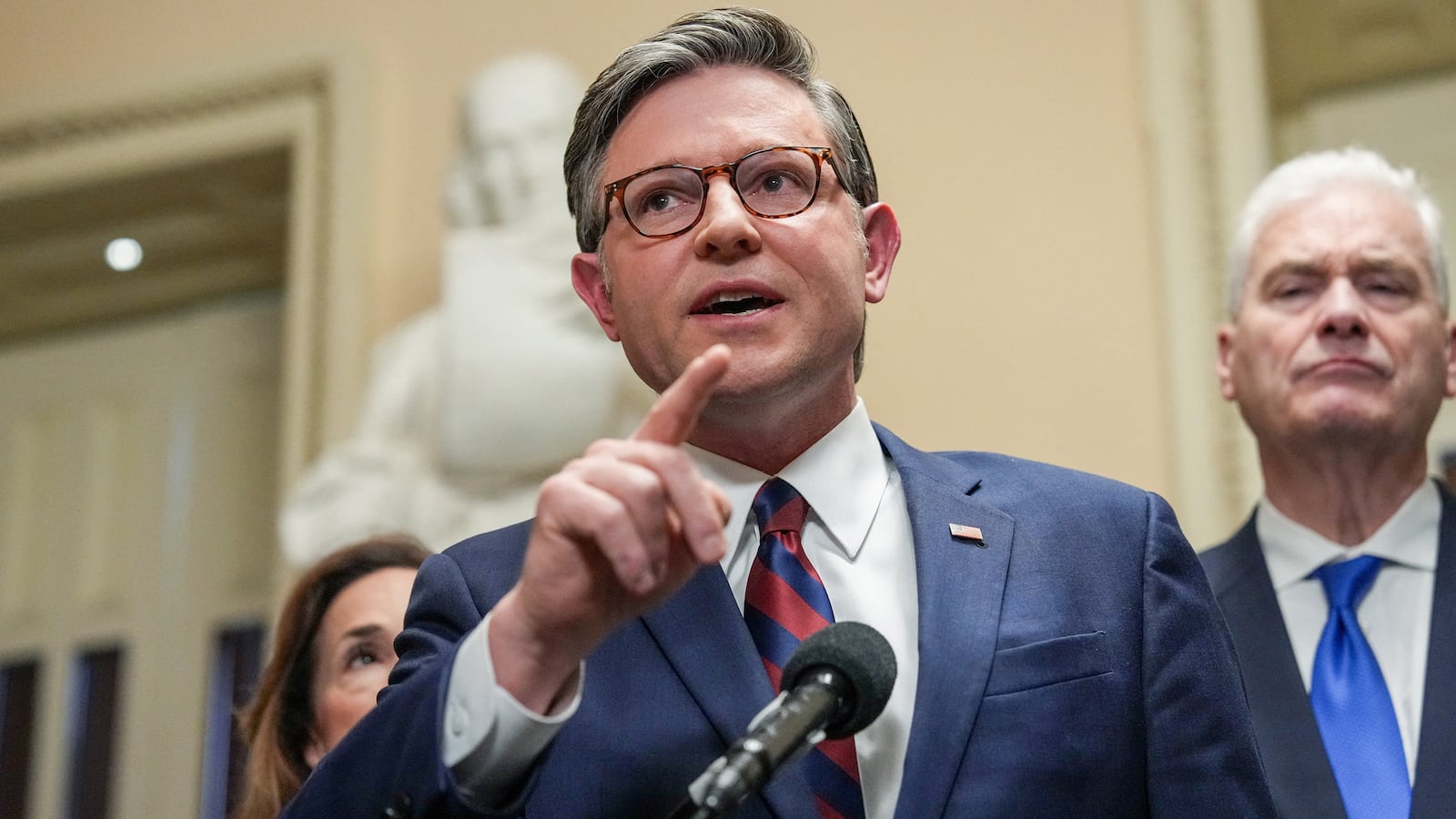 House Speaker Mike Johnson (R-LA) speaks to the media, flanked by House Republican Conference Chairwoman Lisa McClain (R-MI) and House Majority Whip Tom Emmer (R-MN), after the U.S. Senate voted to end a partial government shutdown that has snarled airports across the country, though it did not resolve a dispute over immigration enforcement that prompted the six-week standoff in the first place, on Capitol Hill in Washington, D.C., on March 27, 2026.