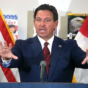 Florida Gov. Ron DeSantis answers a question after announcing a lawsuit against book publishers McGraw Hill, Inc. and Savvas Learning Co., with Florida Attorney General James Uthmeier, during a press conference at Voyager K-8 School in St. Cloud, Florida, Tuesday, Aug. 19, 2025.