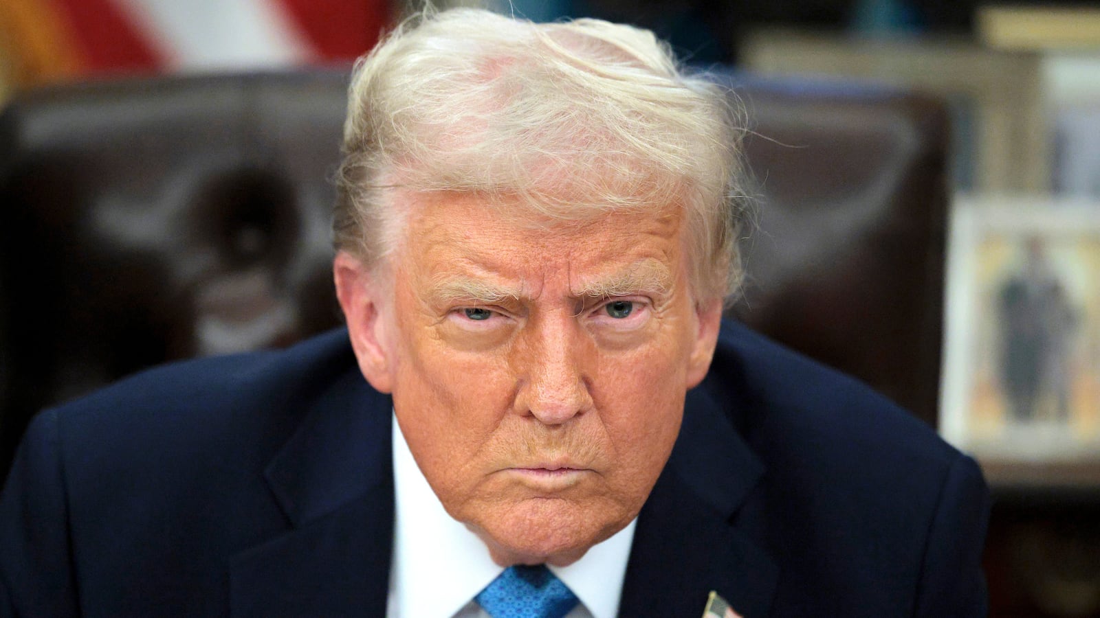 Donald Trump talks to reporters after signing an executive order, "Unleashing prosperity through deregulation," in the Oval Office on January 31, 2025 in Washington, D.C.