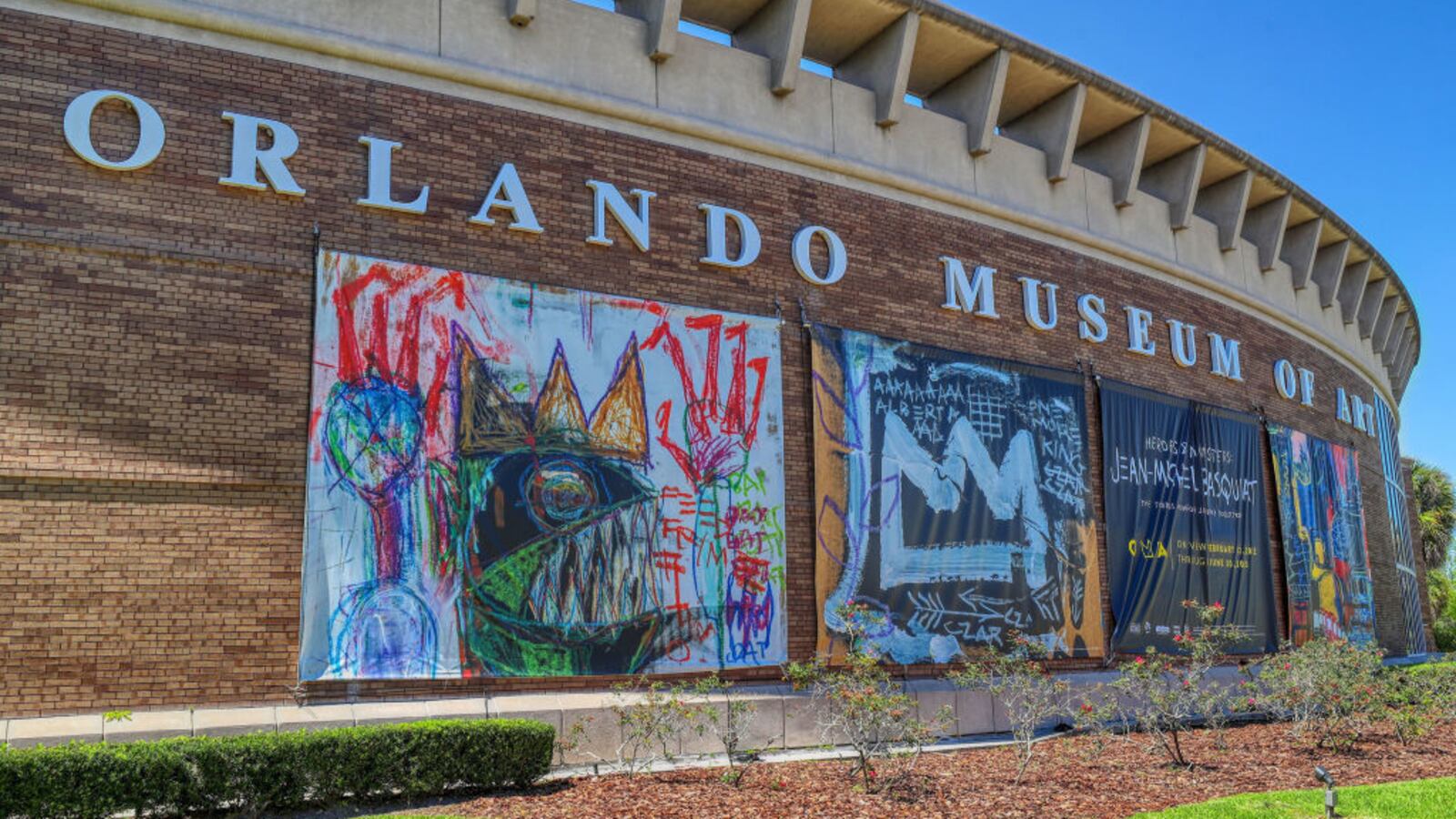 Signs for the Jean-Michel Basquiat exhibit outside the Orlando Museum of Art, on Friday, March 25, 2022.