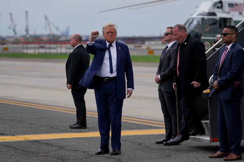 U.S. President Donald Trump gestures upon arrival at Newark Liberty International Airport, after attending Pope Francis' funeral, in Newark, New Jersey, U.S., April 26, 2025. REUTERS/Nathan Howard     TPX IMAGES OF THE DAY