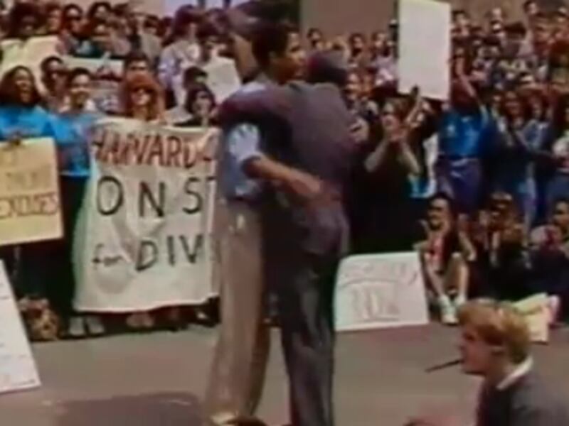 articles/2012/03/09/obama-harvard-video/obama-hug_pv8kp2