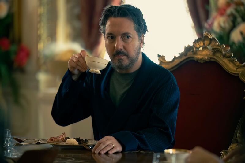A close up of Guillaume Gallienne drinking tea in ‘The Regime’