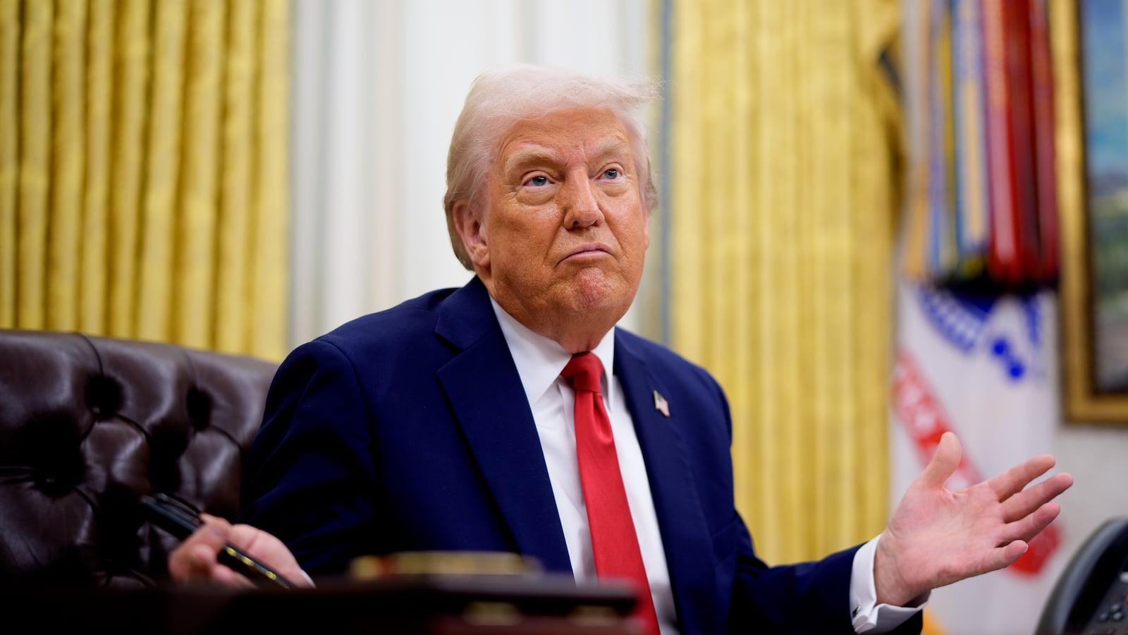 President Donald Trump gestures while speaking during an executive order signing event in the Oval Office of the White House on March 31, 2025