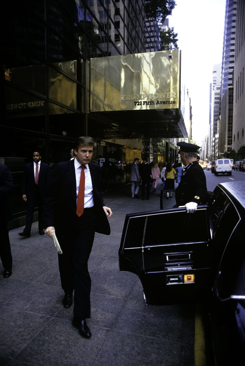 NEW YORK - AUGUST 1987: Donald Trump, real estate mogul, entrepreneur, and billionaire commutes around New York City in his limousine often using this transportation as an office on August 1987 in New York City. (Photo by Joe McNally/Getty Images)