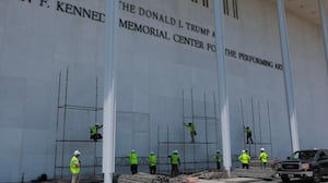 WASHINGTON, DC - JUNE 12: Construction workers build scaffolding near the sign for the Donald J. Trump and John F. Kennedy Memorial Center for the Performing Arts on June 12, 2026 in Washington, DC. The Kennedy Center board voted to seek an emergency appeal to block a court order requiring the removal of President Trump's name from the Kennedy Center. (Photo by Anna Moneymaker/Getty Images)